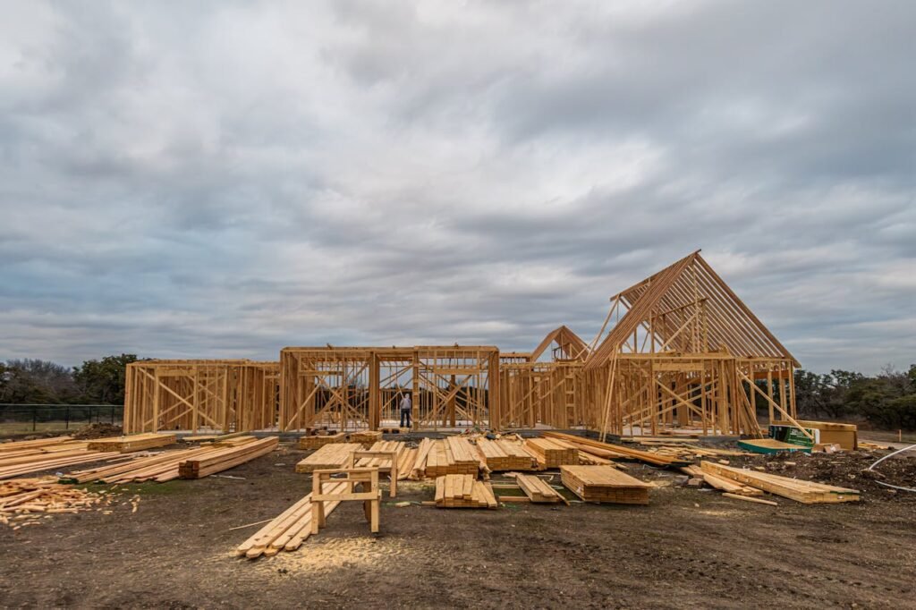 pexels-photo-33404353 East Texas Construction US Services - Wooden house framing under construction in Fort Worth, TX during a cloudy day.